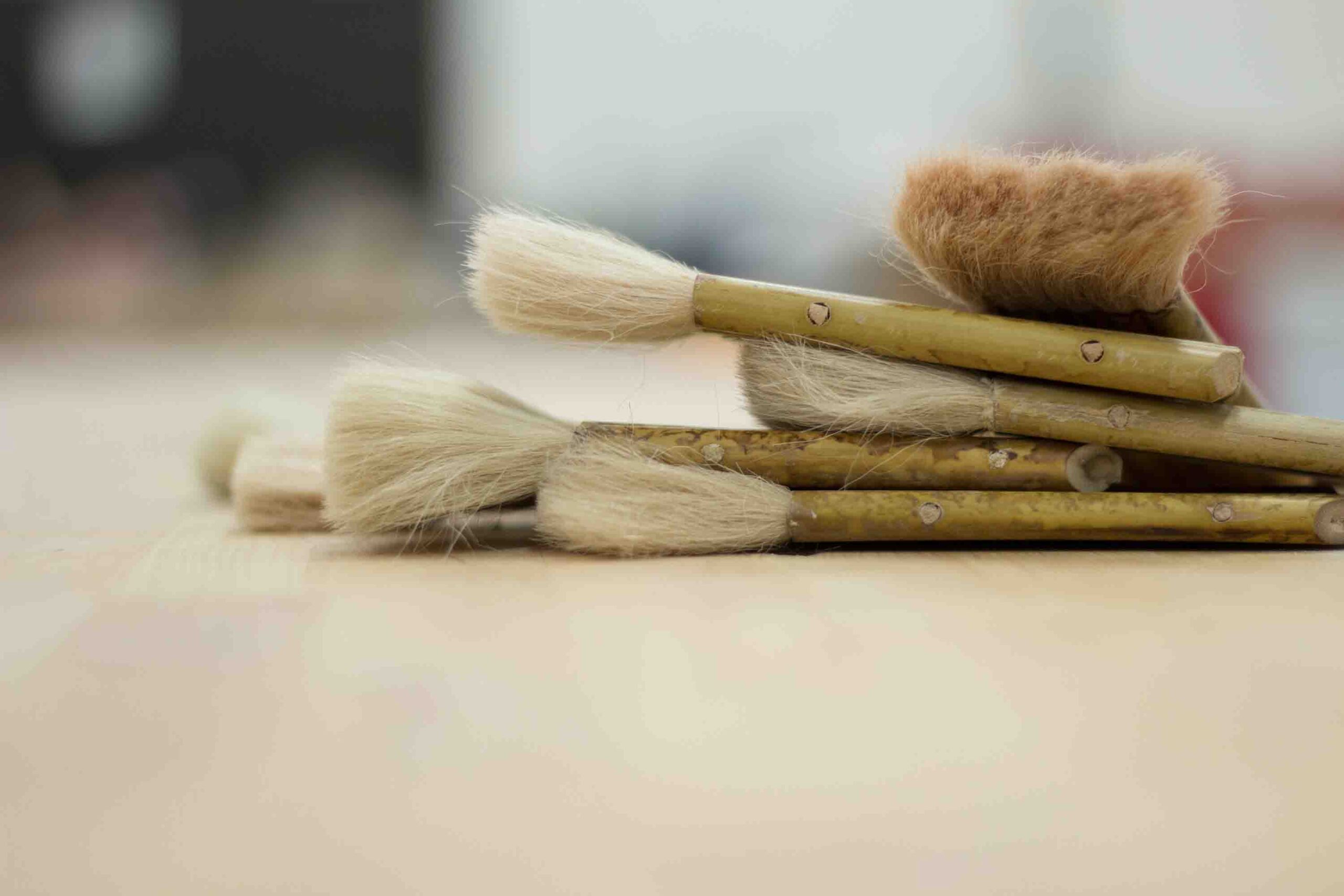 Paint brushes laying on table