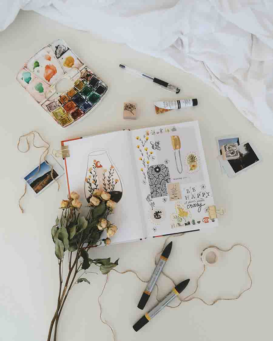 table filled with craft supplies